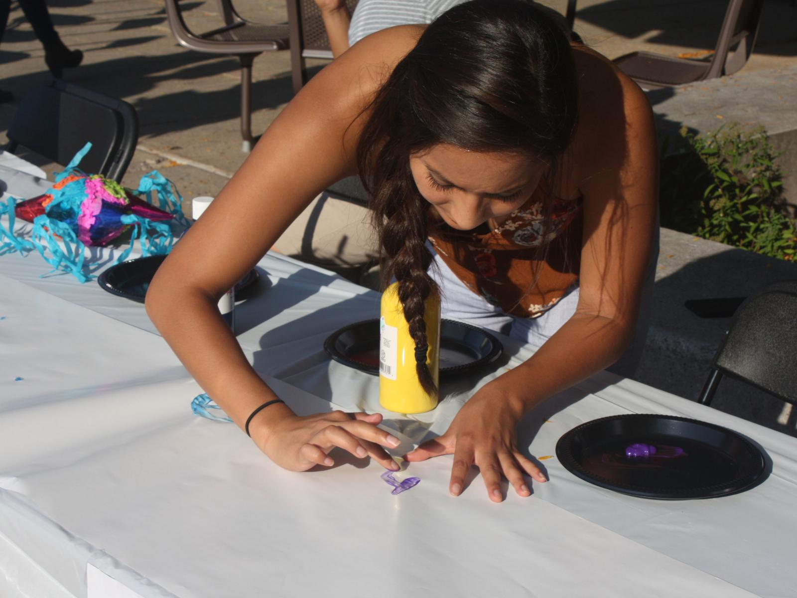 Students celebrate Hispanic heritage with fingerpainting at Fiesta on the Green at the University of Nebraska-Lincoln.
