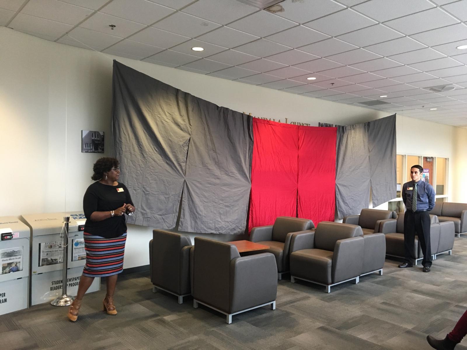 Mandala Lounge artwork covered by sheet at unveiling at the University of Nebraska