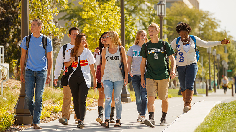 Members of fraternities and sororities walk across campus at the University of Nebraska-Lincoln